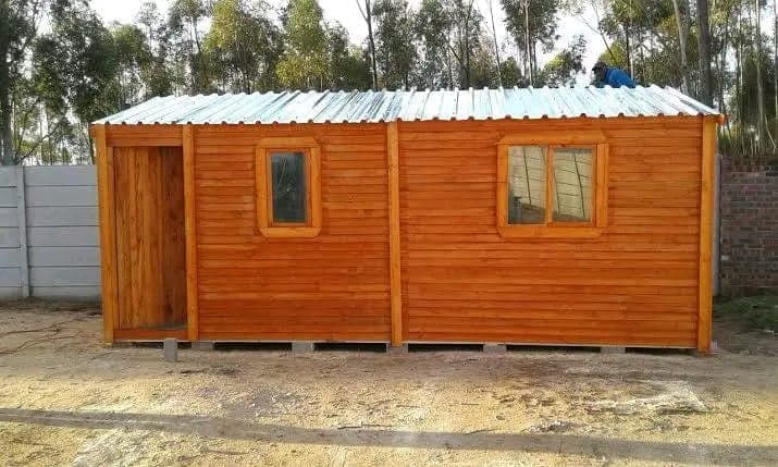 Small timber Wendy house with corrugated iron roof